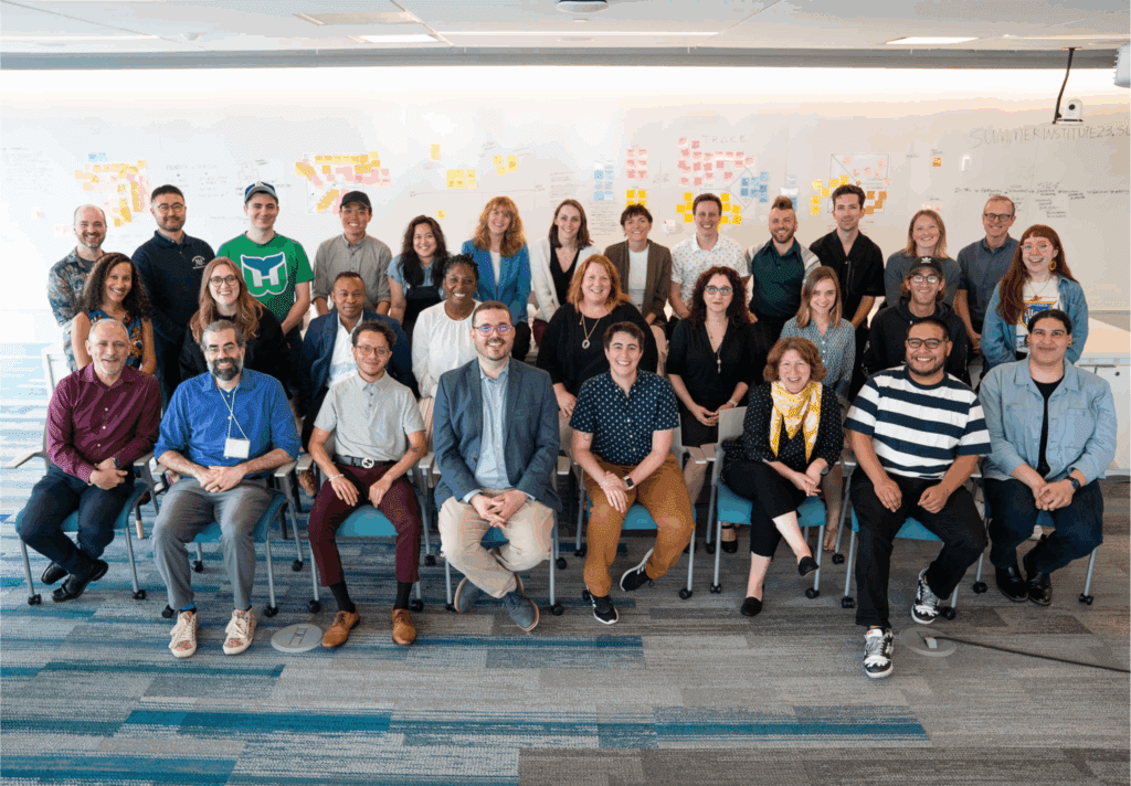 Photo of a large group of people smiling at the Summer Innovation Institute 2023