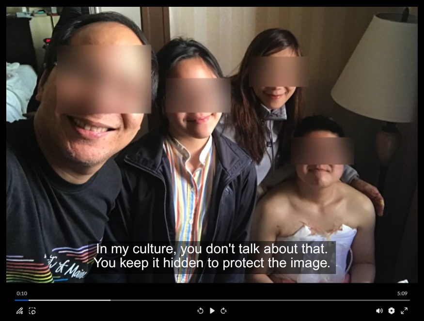 A screenshot from a video made by a study participant. The screenshot shows family members with blurred out eyes taking a selfie and smiling with their trans son who just had top surgery