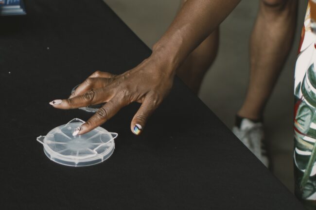 close-up image of a hand touching a hydrogel material