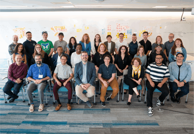 Photo of a large group of people smiling at the Summer Innovation Institute 2023